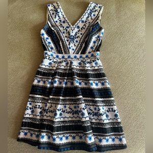 A-line mini boutique dress size small. Blue black and white detailing.
